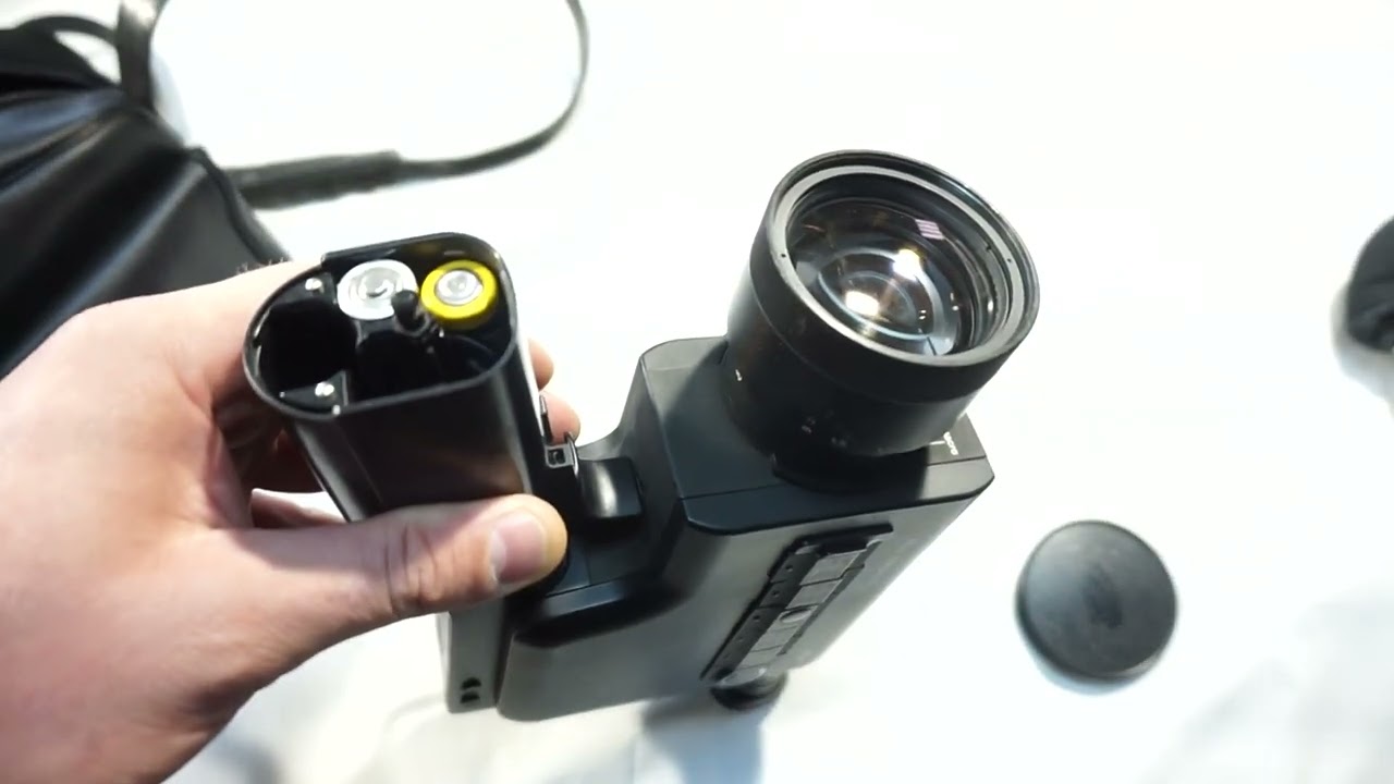 Nizo Integral 7 loading Super 8 film and batteries on Super 8