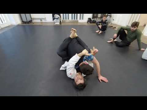 Side closed guard sweep