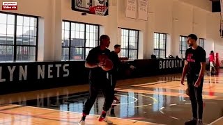 DeMar DeRozan teaches some trick to Zach Lavene after today Bulls practice at Nets training facility