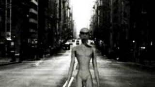 Naked alien walks on the street