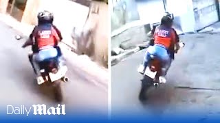 Motorcyclist in high-speed police chase through Brazil’s favelas with woman on the back of his bike