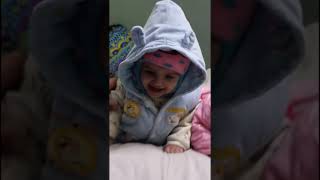 floating twins/9 months old twins on bed