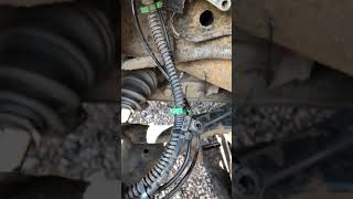 Discovery 3 front brake pad sensor location 