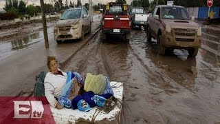 Aumentan las víctimas por inundaciones en Chile / Titulares de la tarde