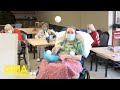 Nursing home residents enjoy an epic indoor snowball fight