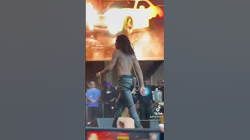 Thumbnail of Wiz Khalifa sprays water out of his mouth during “Black and Yellow” at The Smokers Club Festival