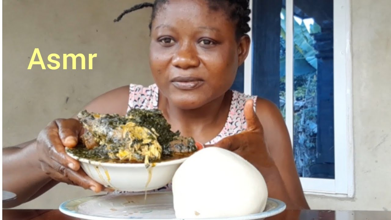 African food Mukbang vegetable soup with fufu fresh fish  cow skin and periwinkle