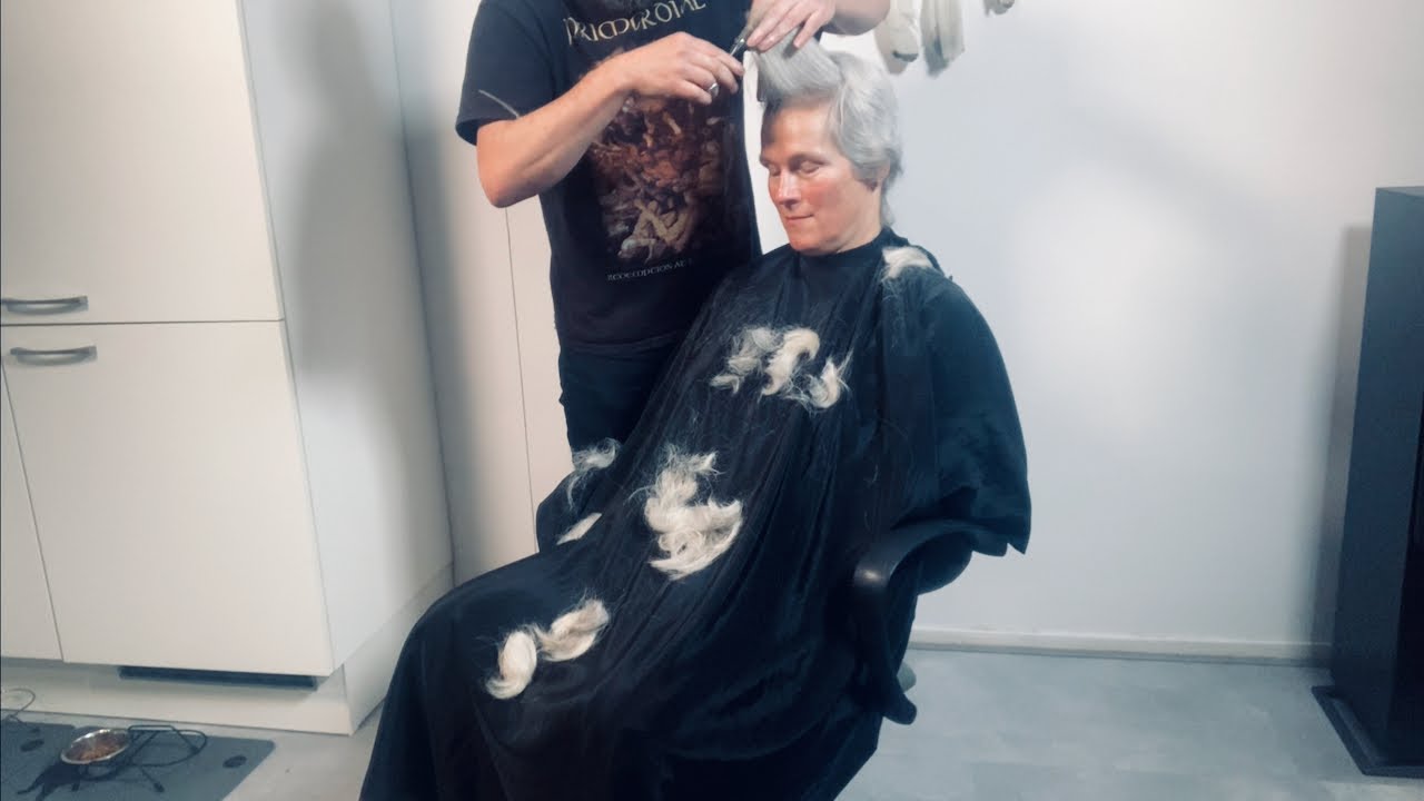 A stunning grey pixie! This lady rocks a very short haircut!