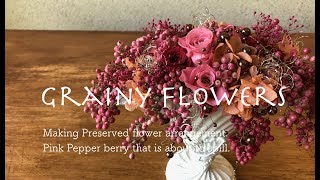 Making Preserved flower arrangement.Pink Pepper berry that is about to spill.