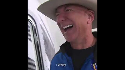 Jeff Bezos laughing like he