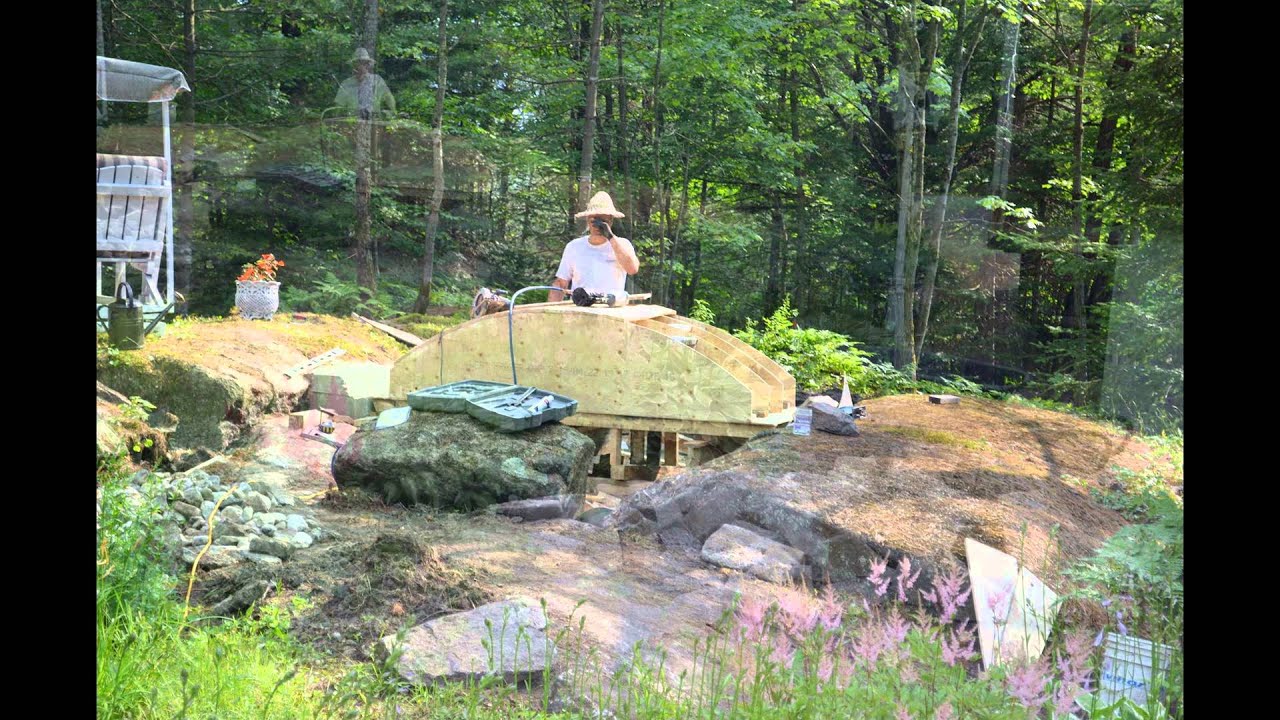 Dry Stone Arch Bridge over water garden