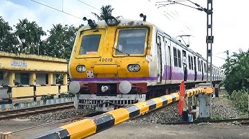 Aerodynamic loud honking EMU local trains passing through busy rail gate | Level crossing video