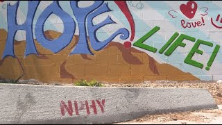 Volunteers bring two murals to life at Las Vegas youth homeless center
