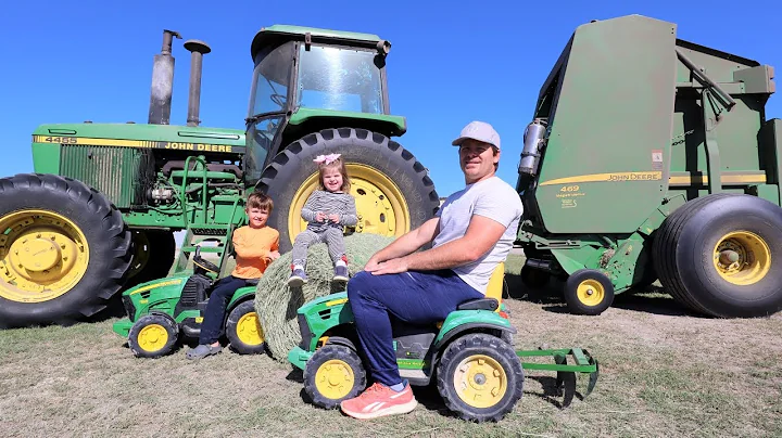 Playing with kids tractors and real tractors on th...