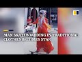 Chinese man skateboarding in traditional clothes becomes internet star