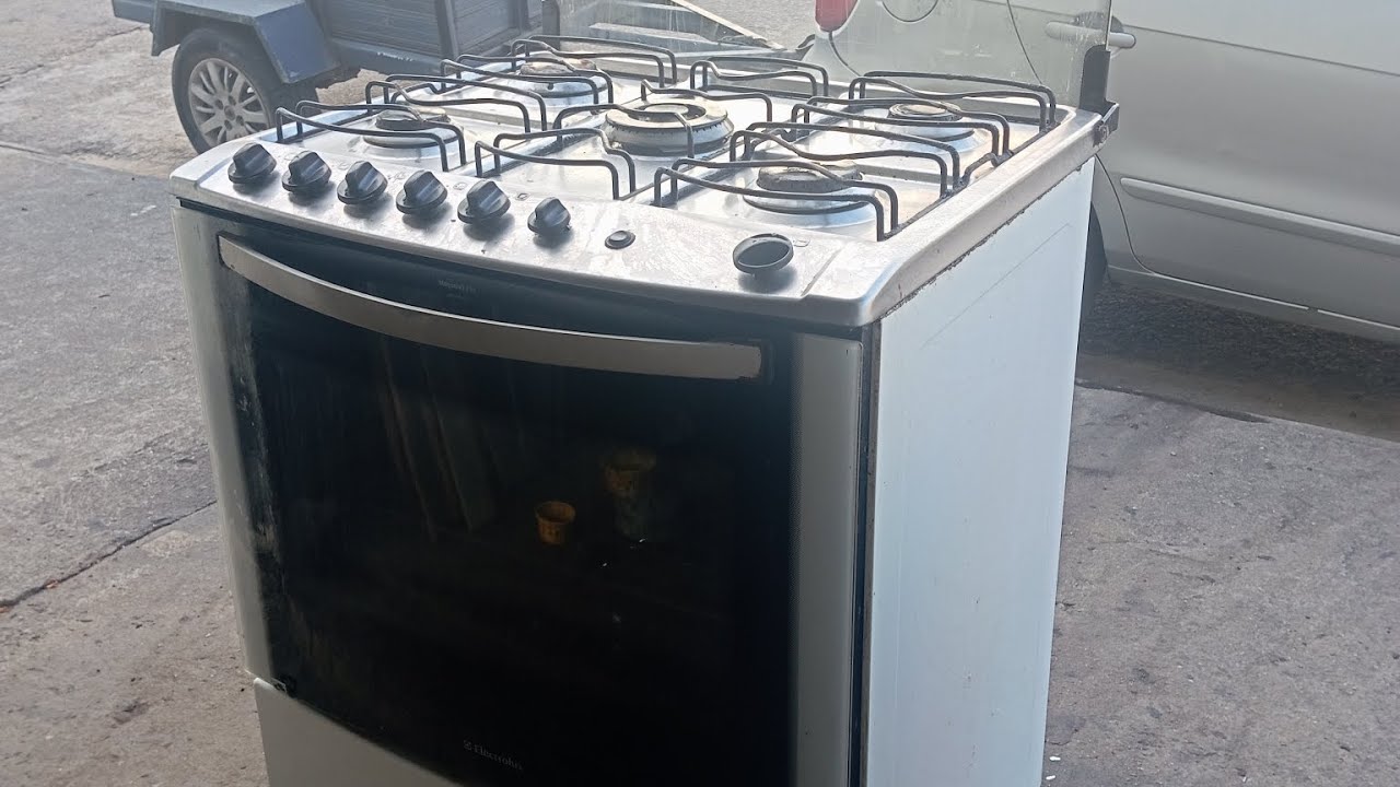 o vidro da porta do fogão Electrolux soltou, como retirar a porta do forno para consertar