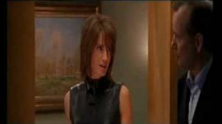 Kelly Lynch in sexy leather dress