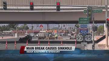 Water main break causes sinkhole