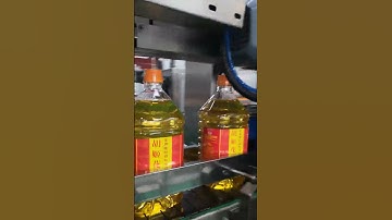 Automatic oil bottle handle applicator machine