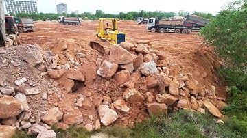 Good Operator Skills On Huge Land Filling Up Dozer Push Big Stones Stones