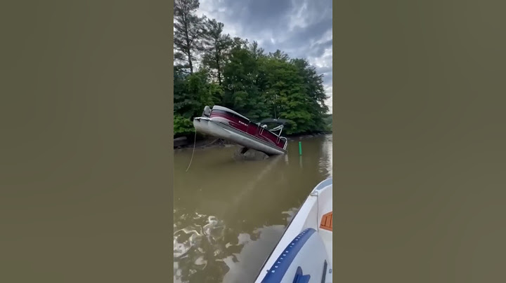 Pontoon Boat hits big rock
