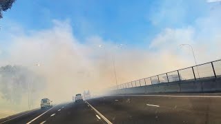 South Africa | Smoke from veld fires along the R300 near the Cape Town International Airport