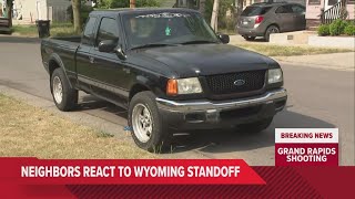 Neighbors react to search for man linked to GR woman's death