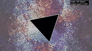 A rotating triangle in a granular medium: kinetic energy and direction