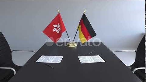 Flags of Hong Kong and Germany and Papers on the Table | Motion Graphics - Envato elements