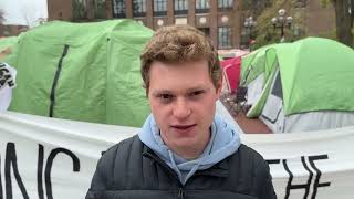 Israel supporter stands near pro-Palestinian protesters at University of Michigan