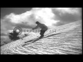 Men sliding downhill and demonstrating the stem turn in the United States. HD Stock Footage