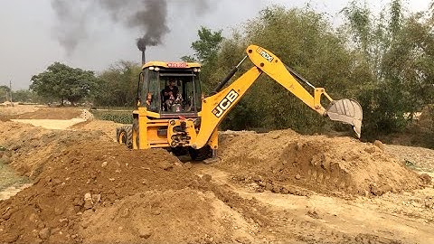 JCB Backhoe Loader Working Road Construction - JCB Backhoe Machine Leaving Mud