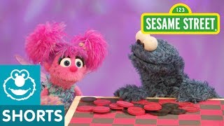 Sesame Street Cookie Monster Plays eats Checkers