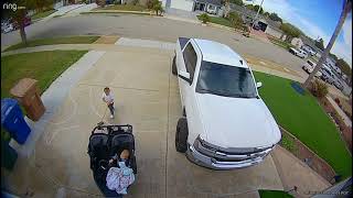 Baby sits in double stroller then little boy pulls it down (Security camera)