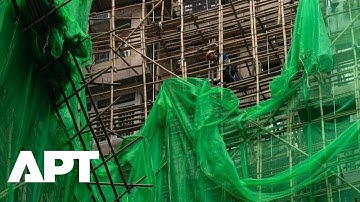 Hongkong verwijdert groen gaas na dodelijke brand in gebouw, wat leidt tot veiligheidsverbetering...