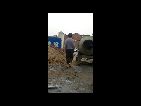 Quezi walked barefoot on wet cement at the construction site