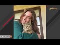 Feral cat melts in her new mom's arms