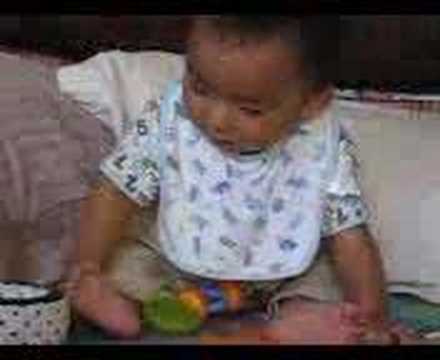 Nico playing with a wheel with Nanny Elsa