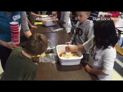 Third through fifth graders make baked ziti for the hungry at East Goshen Elementary School.