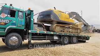 VOLVO EC210B Excavator Moves With Fuso Self Loader Truck