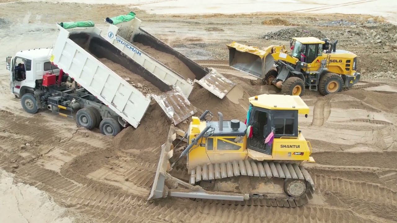 Advanced Strong Abul pushes the ground rock sand dump truck unloading rock soil sand skill driver