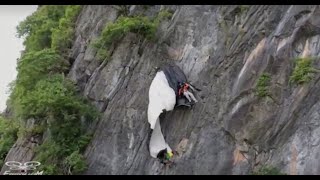 Watch the dramatic rescue of a BASE jumper caught dangling on a cliffside in Thailand