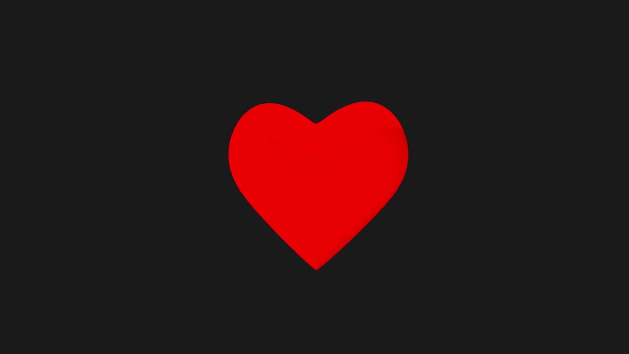 Red volumetric 3D heart on a dark gray background. Love, romance.