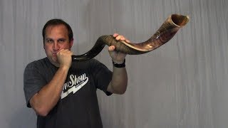 Talking about and playing the kudu horn (shofar).