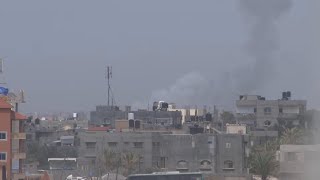 Smoke from airstrike billows over Gaza Strip as seen from Muwasi tent camp for displaced