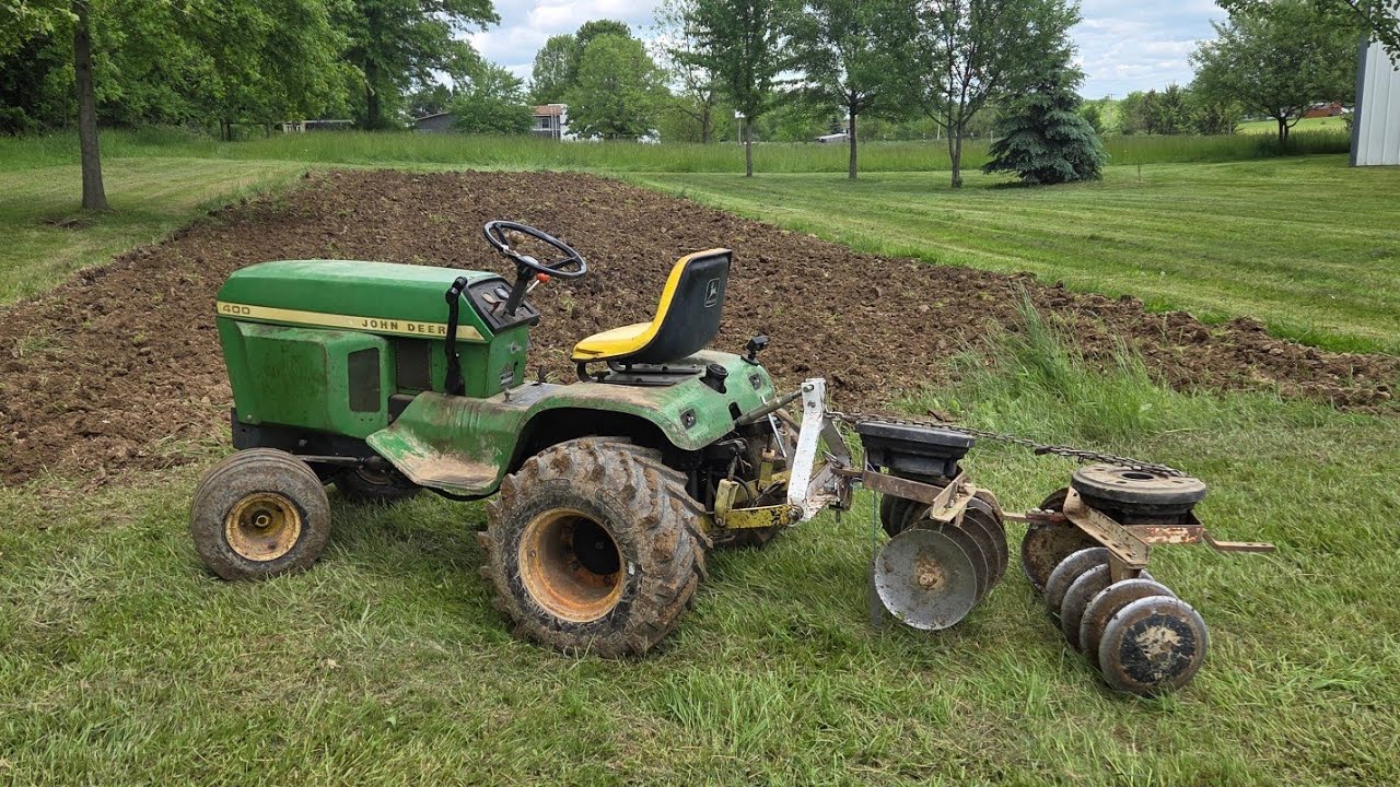 Disking the garden with John Deere 400