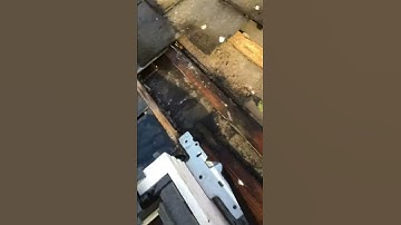 Velux window fitted badly with capillary attraction under slate and flashing junction