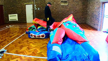 Rolling A Bouncy Castle With Slide on A SLIPPERY FLOOR! - Bouncy Castles Videos