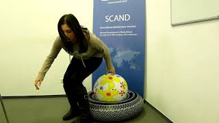 Girl sits and pop beachball