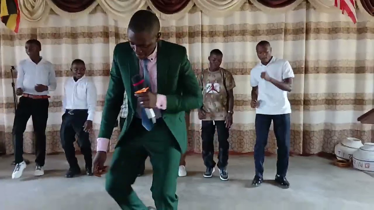 Brian Asiimwe singing Katambaala song at Kagongo Full Gospel Church